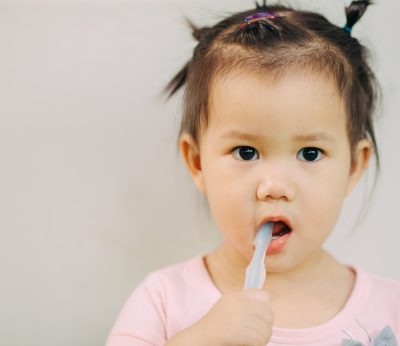 baby-brushing-her-teeth-dental-care-activity-tooth-gums.jpg
